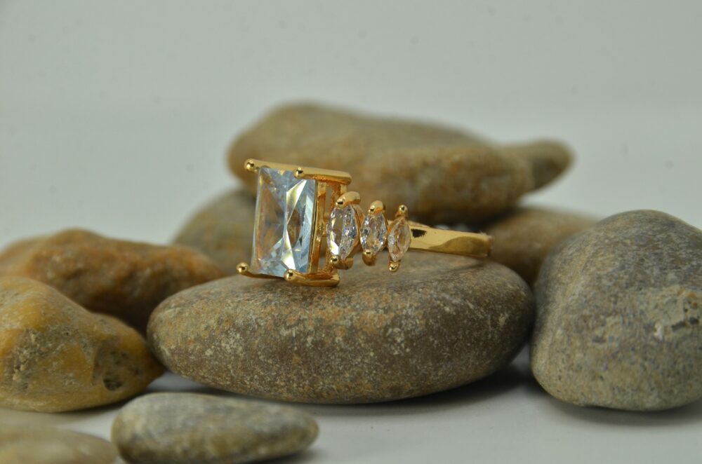 Gold-plated zircon ring featuring a large emerald-cut center stone flanked by marquise-cut side accents for a luxurious look. - Image 3