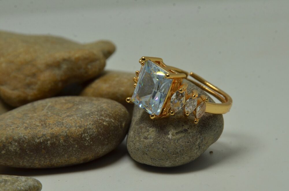 Gold-plated zircon ring featuring a large emerald-cut center stone flanked by marquise-cut side accents for a luxurious look. - Image 2