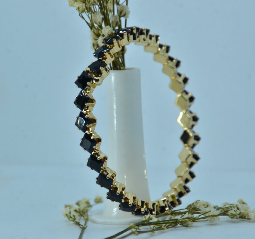 Gold-plated bracelet featuring a sleek zigzag design with square-cut black stones for a bold, modern look - Image 2