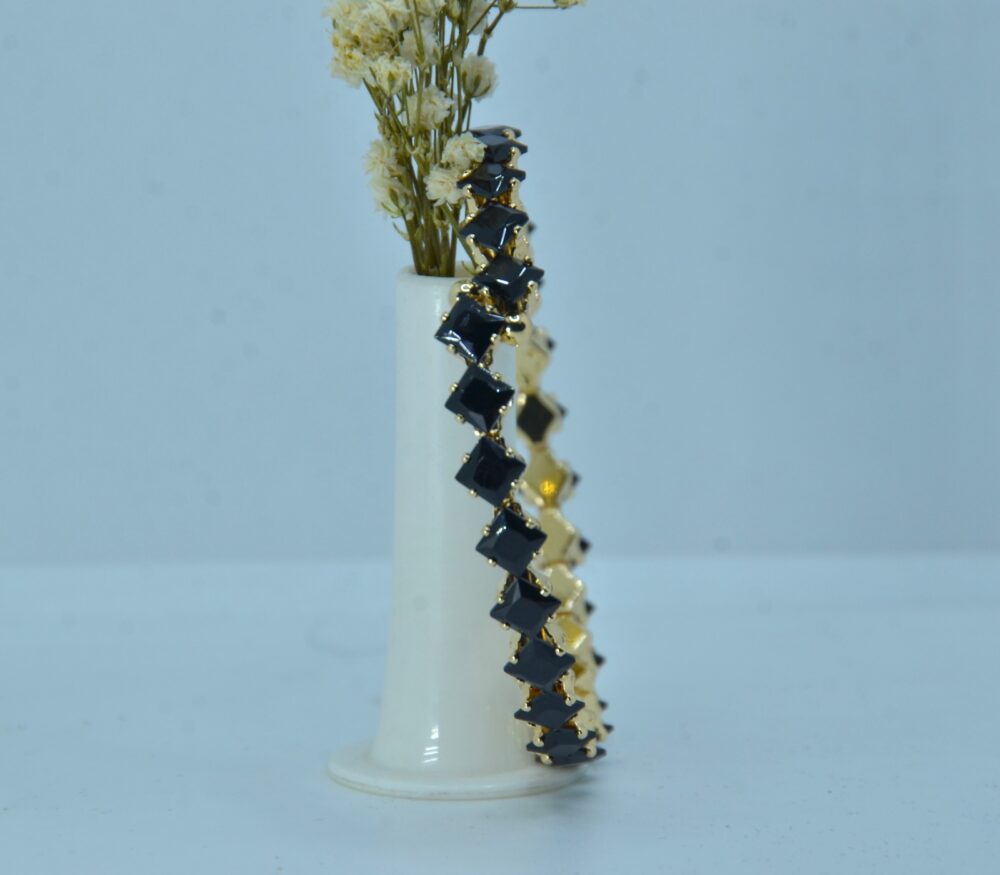 Gold-plated bracelet featuring a sleek zigzag design with square-cut black stones for a bold, modern look - Image 3