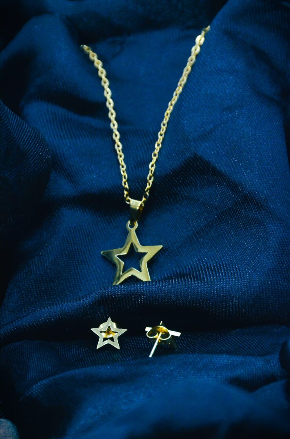 Charming gold jewelry set featuring a hollow star pendant and matching stud earrings for a playful, elegant look. - Image 2