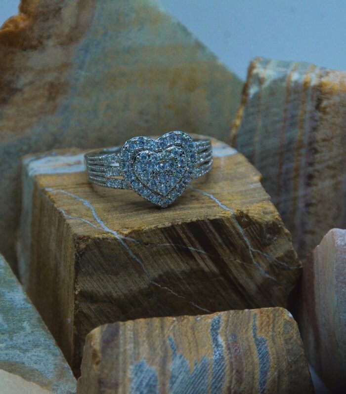 Elegant silver ring adorned with a sparkling double-layered heart design encrusted with zircon stones.