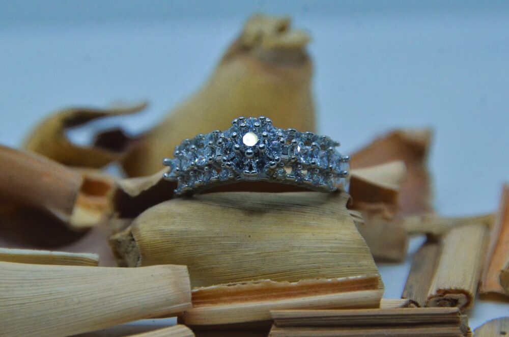 Elegant silver ring adorned with a row of shimmering white zircon stones, perfect for timeless sophistication.] - Image 3