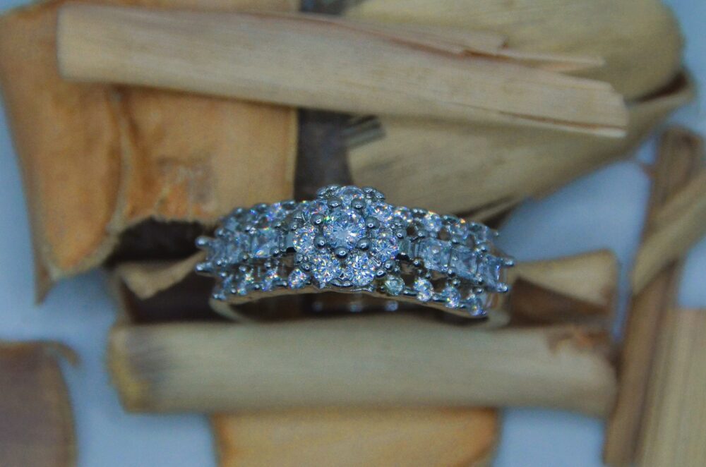 Elegant silver ring adorned with a row of shimmering white zircon stones, perfect for timeless sophistication.] - Image 2